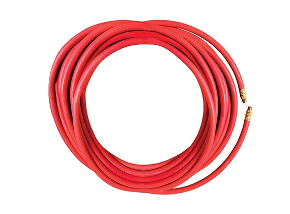 A roll of red fuel oil delivery rubber hose with fittings