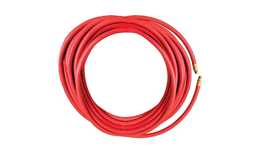 A roll of red fuel oil delivery rubber hose with fittings.